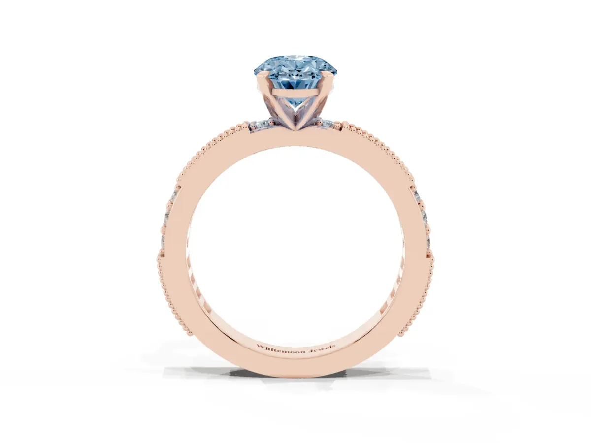 Fancy Blue Oval Cut Solitaire with Pavé Band and Four-Prong Setting Rose gold