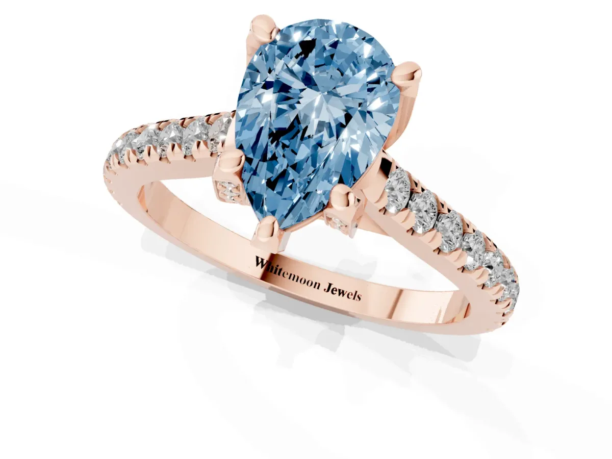 Fancy Blue Pear Cut Brilliant Diamond Solitaire with Pavé Band and Four-Prong Setting Rose gold