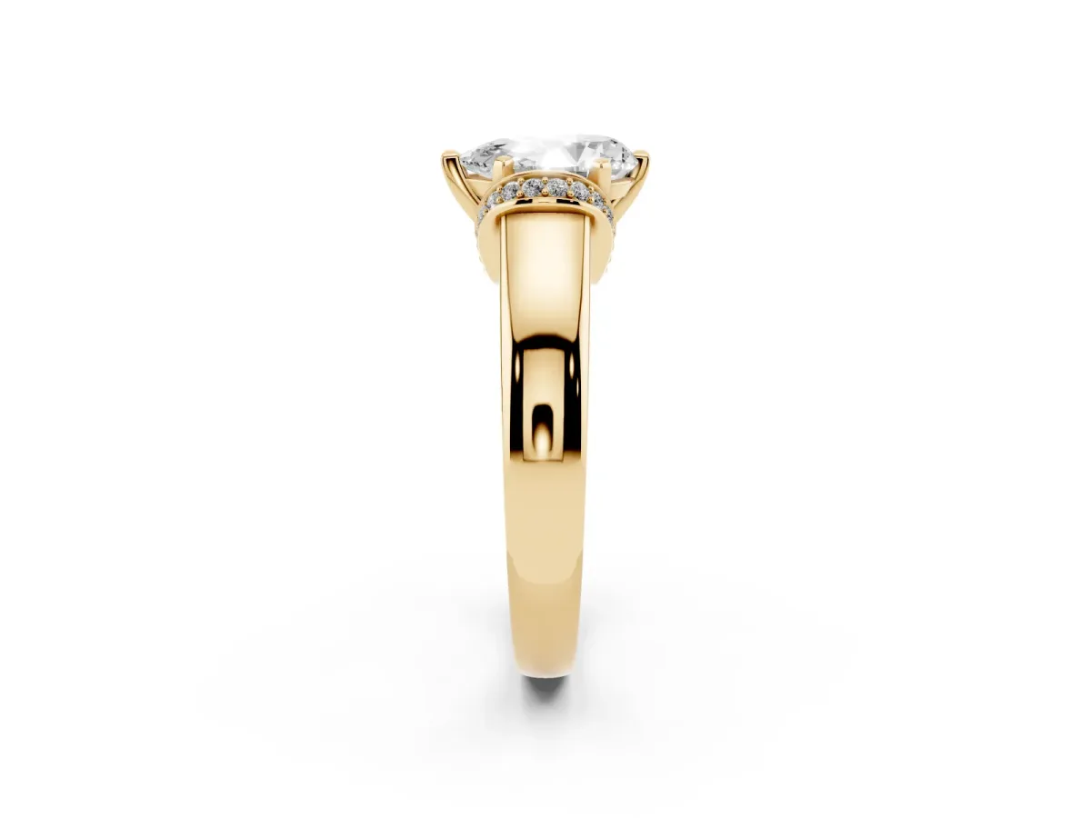 Pear Cut Solitaire Diamond Ring with Pave Band and Six-Prong Setting Yellow gold