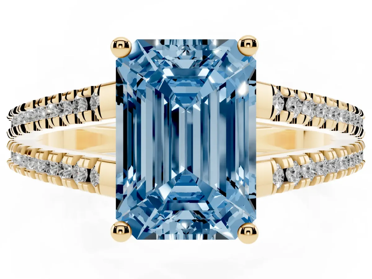 Fancy Blue Emerald Cut Diamond Solitaire Engagement Ring with Split Shank Pavé Band Yellow gold