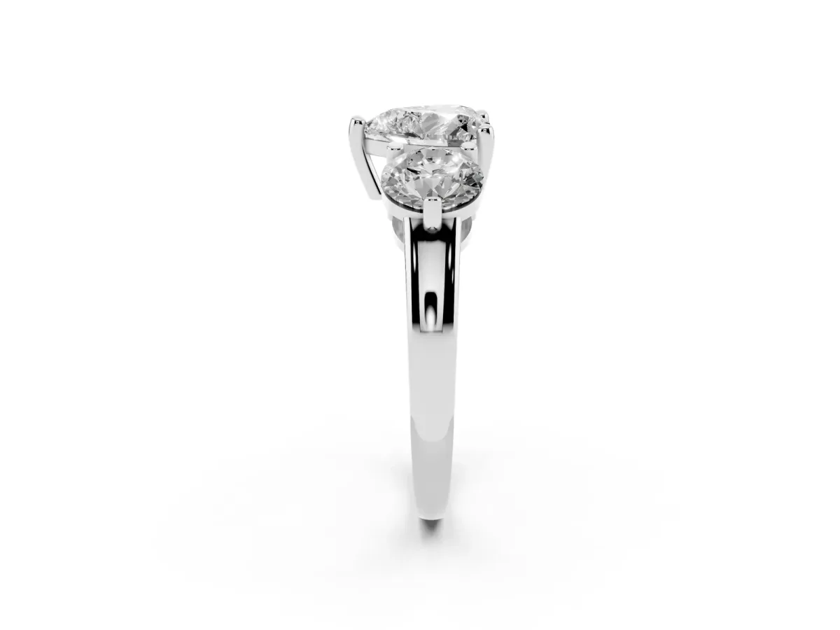 Three-Stone Heart Cut Brilliant Cut Solitaire Ring with Prong Setting on a Classic Band Silver