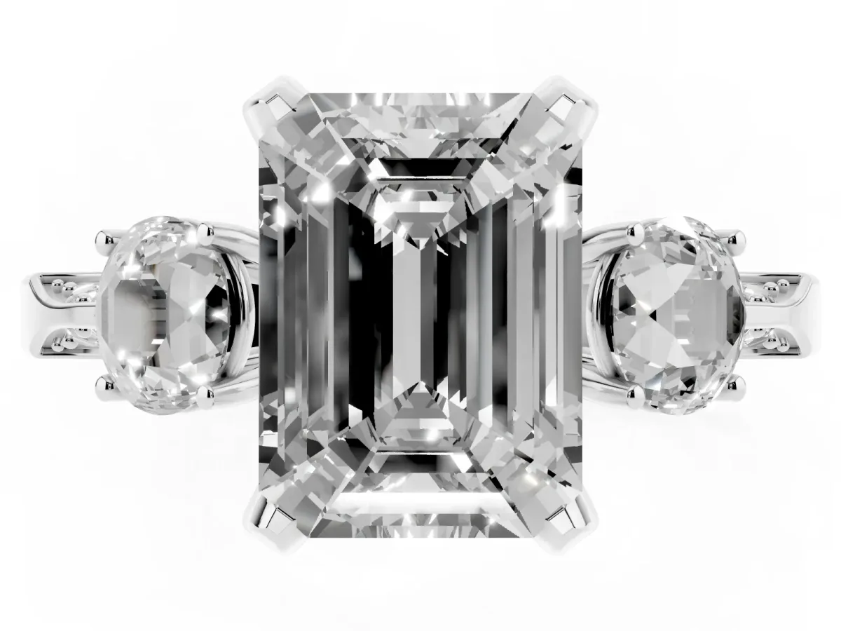 Emerald Cut Brilliant Three-Stone Diamond Ring with Pavé Band and Four-Prong Setting White gold