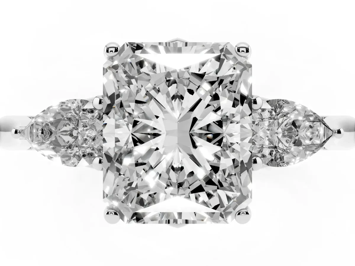 Three-Stone Radiant Cut Diamond Ring with Pear Side Stones in Four-Prong Setting Silver