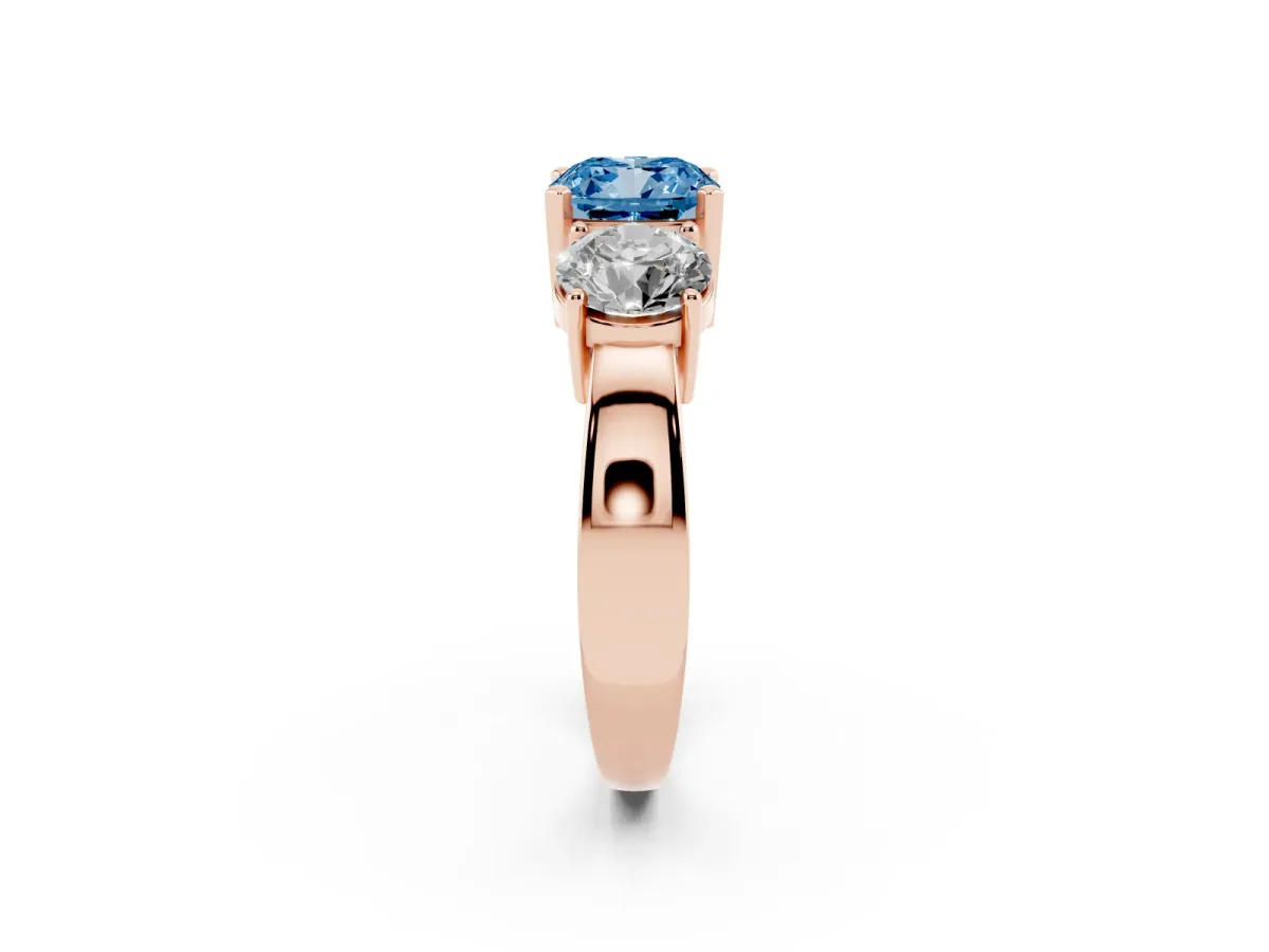 Fancy Blue Three-Stone Cushion Cut Diamond Ring with Round Side Stones, Classic Band, and Four-Prong Setting Rose gold