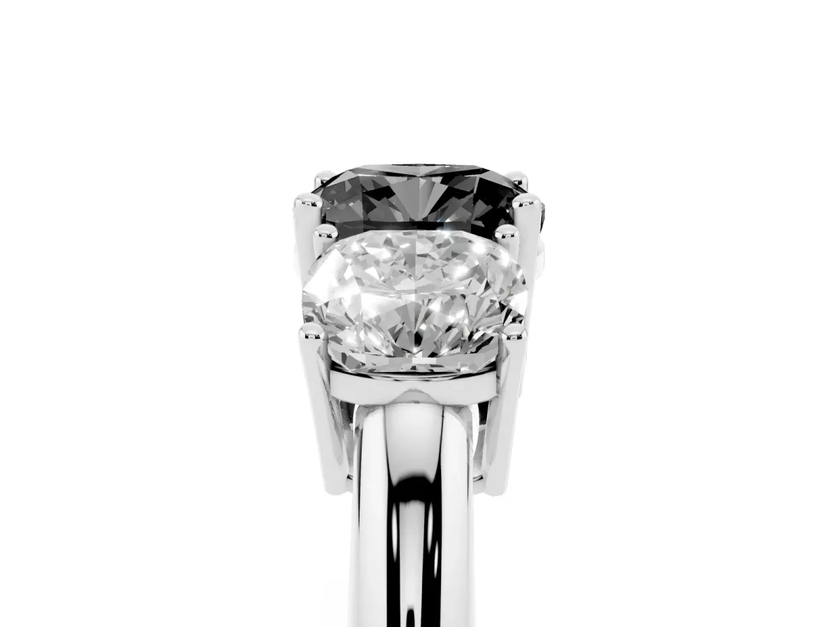 Fancy Black Three-Stone Cushion Cut Cut Diamond Engagement Ring with Prong Setting on a White Gold Band Platinum