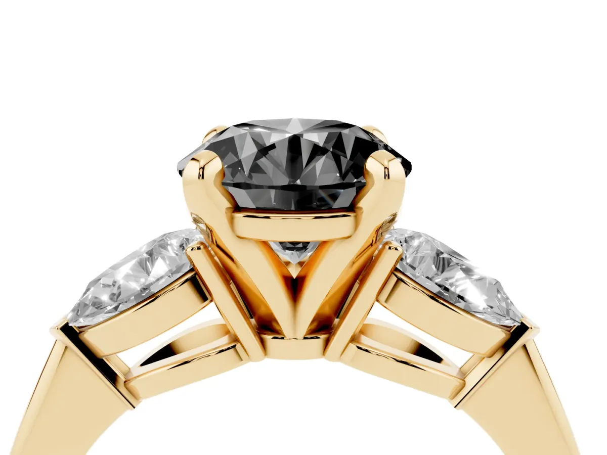 Fancy Black Three-Stone Round Cut Diamond Ring with Pear Side Stones and Four-Prong Setting Yellow gold