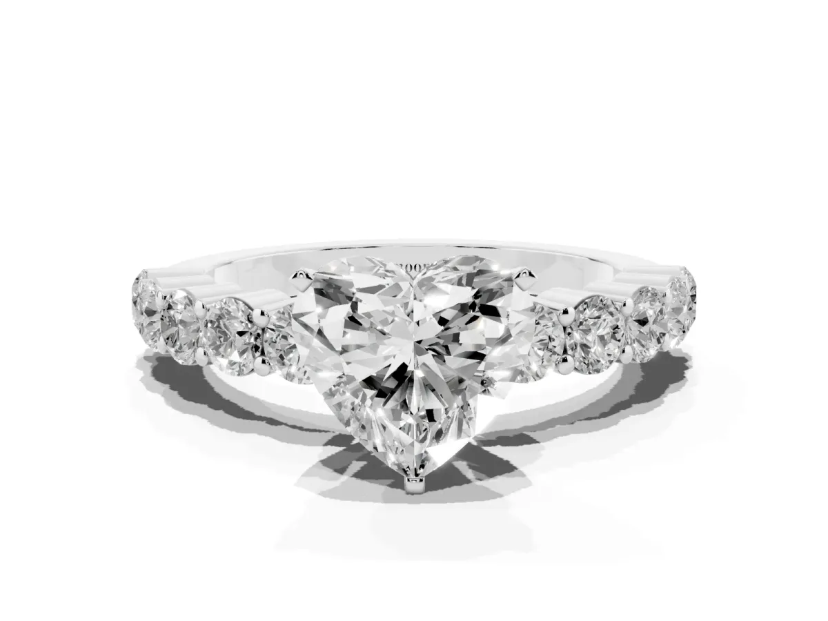 Heart Cut Diamond Solitaire Ring with Shared Prong Round Side Stones Silver