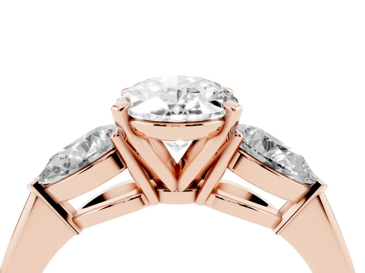 Three-Stone Oval Cut Diamond Ring with Pear Side Stones and Four-Prong Setting Rose gold