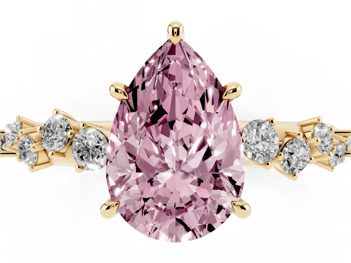 Fancy Pink Pear Cut Diamond Cluster Side Stone Solitaire Ring with Prong Setting Yellow gold