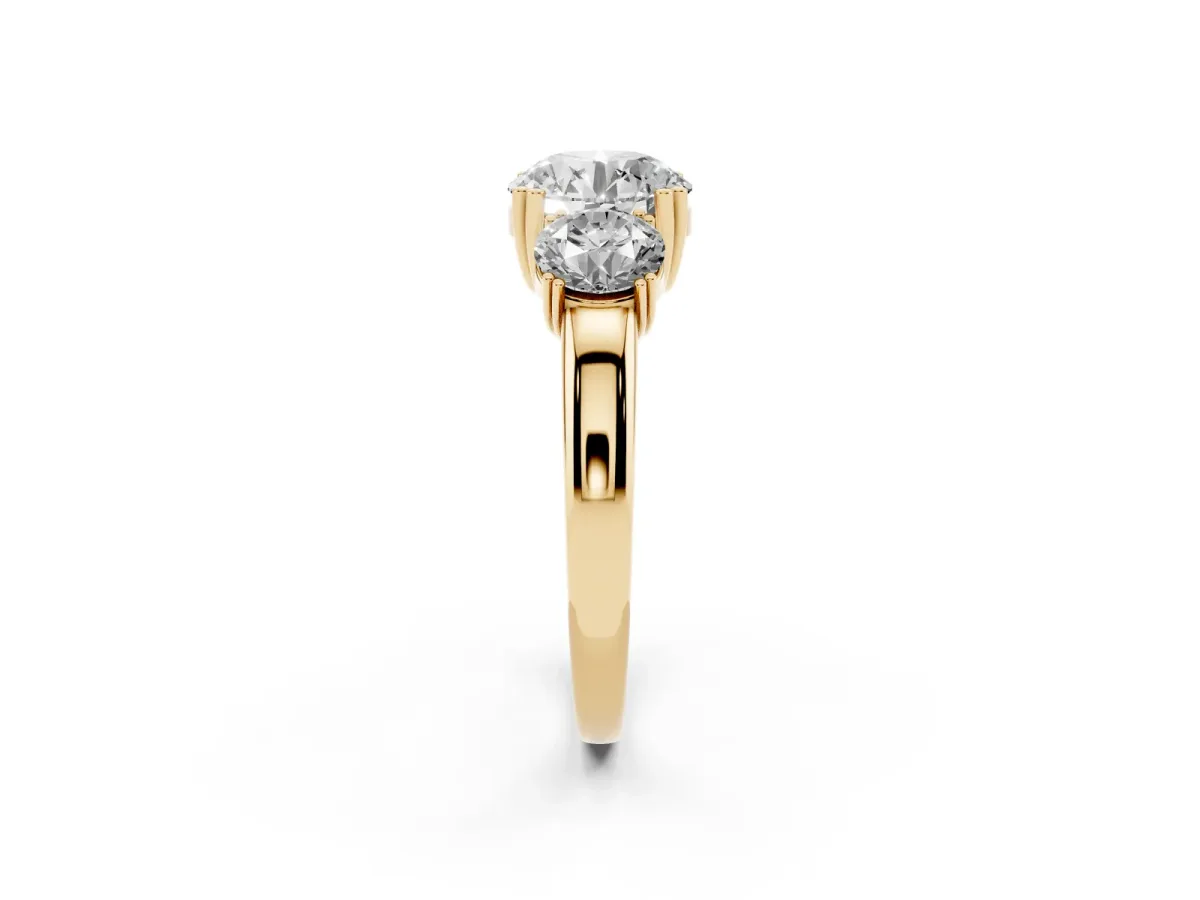 Three-Stone Round Cut Cut Diamond Ring with Channel Set Band and Four-Prong Setting Yellow gold