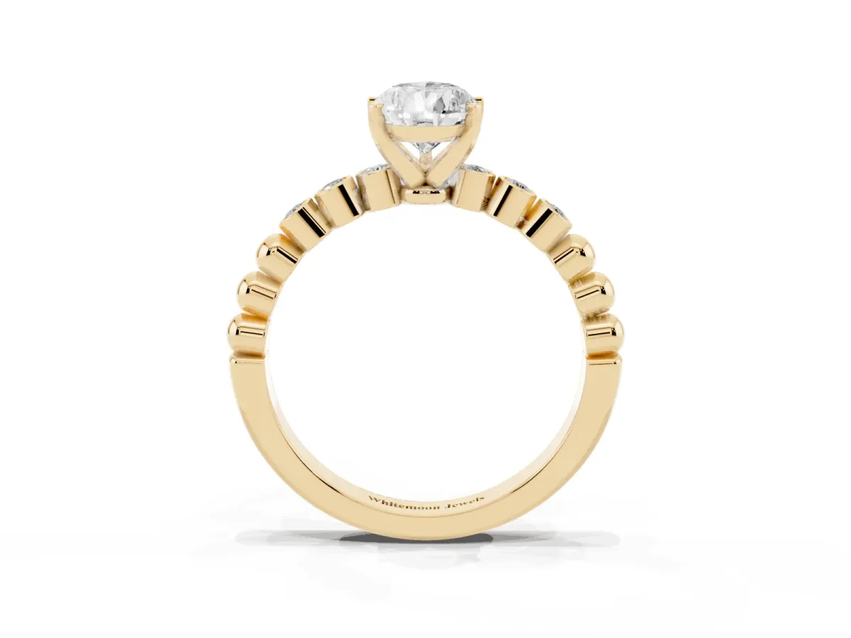 Pear Cut Solitaire Bezel Accent Diamond Engagement Ring with Beaded Band and Four-Prong Setting Yellow gold