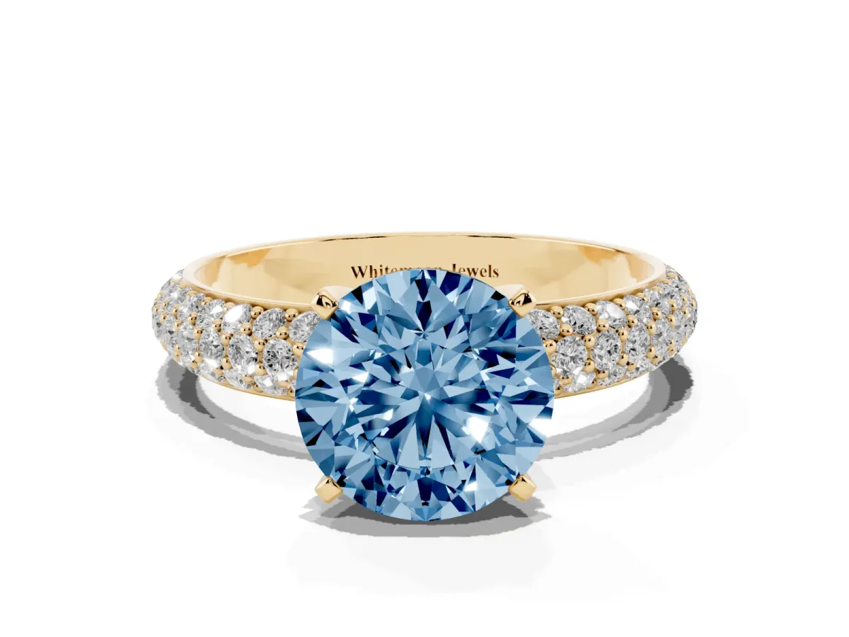 Fancy Blue Round Cut Diamond Solitaire Ring with Prong Setting and Pavé Band Yellow gold