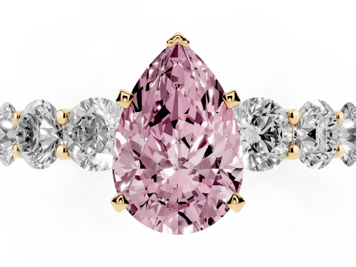 Fancy Pink Pear Cut Diamond Prong Setting with Side Stones on a Pave Band Yellow gold