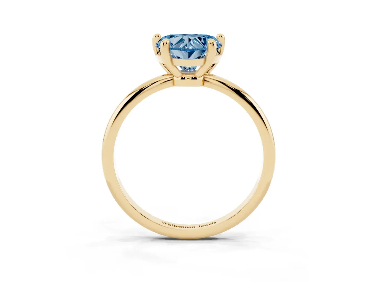 Fancy Blue Heart Cut Solitaire Diamond Ring with 4-Prong Setting on a Classic Band Yellow gold