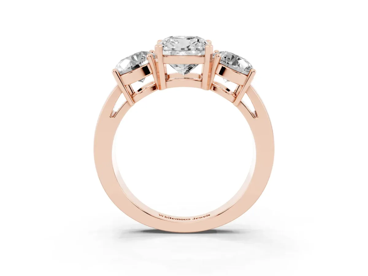 Three-Stone Cushion Cut Diamond Ring with Round Side Stones, Classic Band, and Four-Prong Setting Rose gold