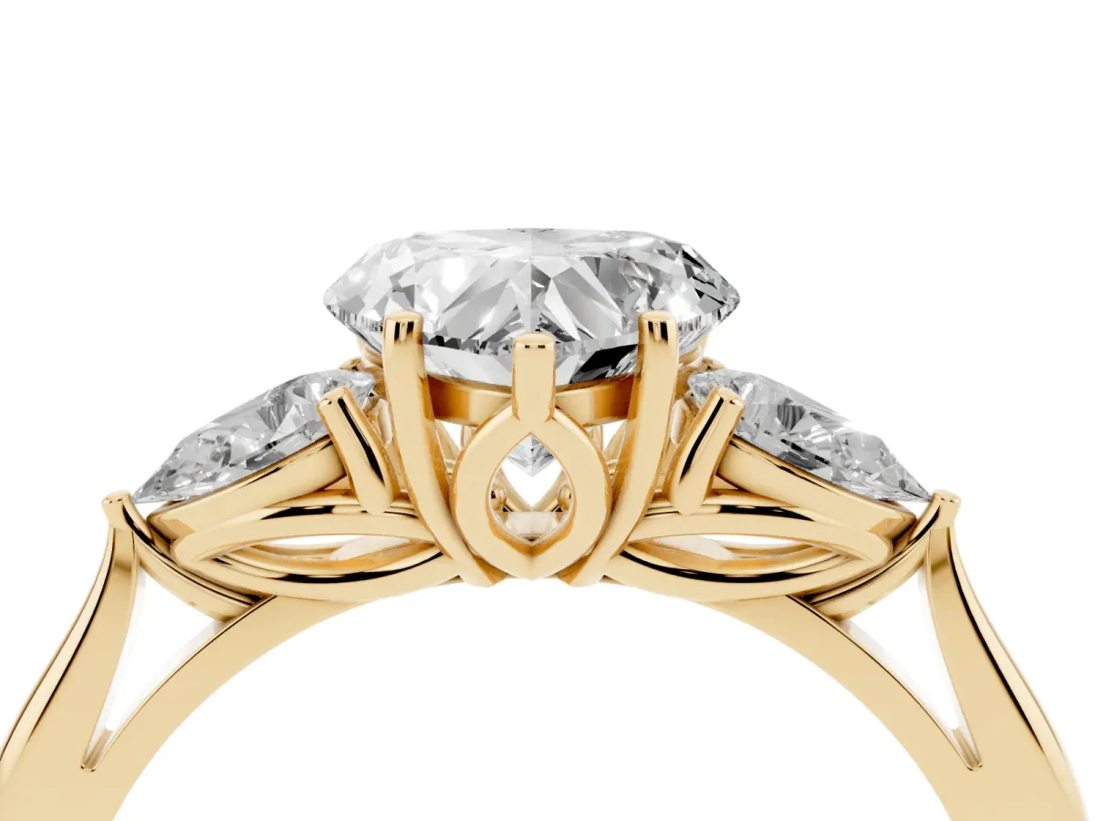 Heart Cut Diamond Three-Stone Ring with Pear Side Stones and Prong Setting Yellow gold