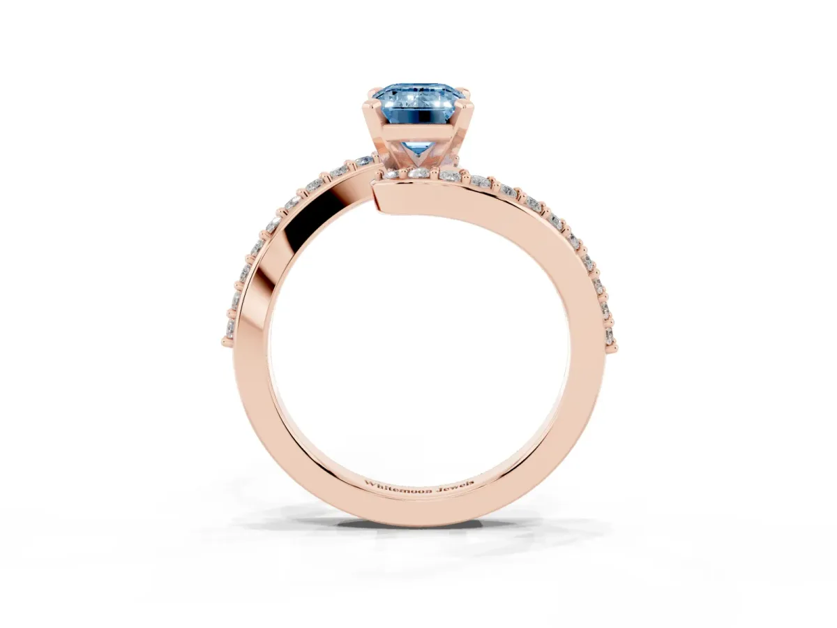 Fancy Blue Emerald Cut Solitaire Twist Band with Pave Set Diamonds and Four-Prong Setting Rose gold