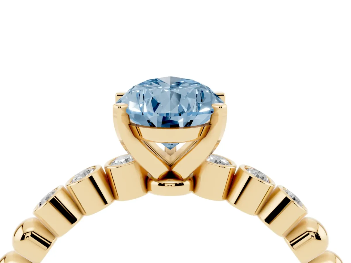 Fancy Blue Pear Cut Solitaire Bezel Accent Diamond Engagement Ring with Beaded Band and Four-Prong Setting Yellow gold