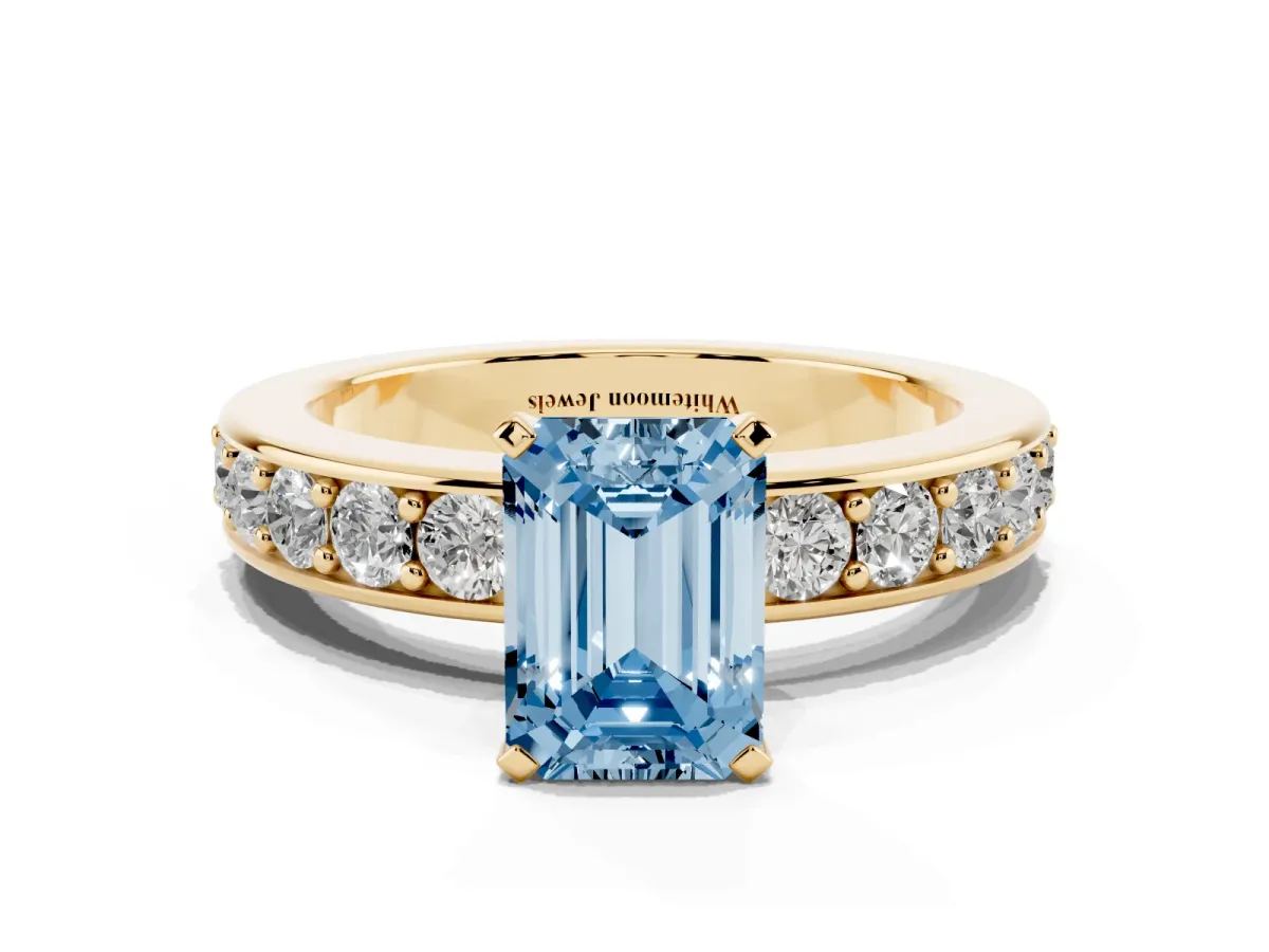 Fancy Blue Emerald Cut Diamond Engagement Ring with Channel Set Round Band and Prong Setting Yellow gold
