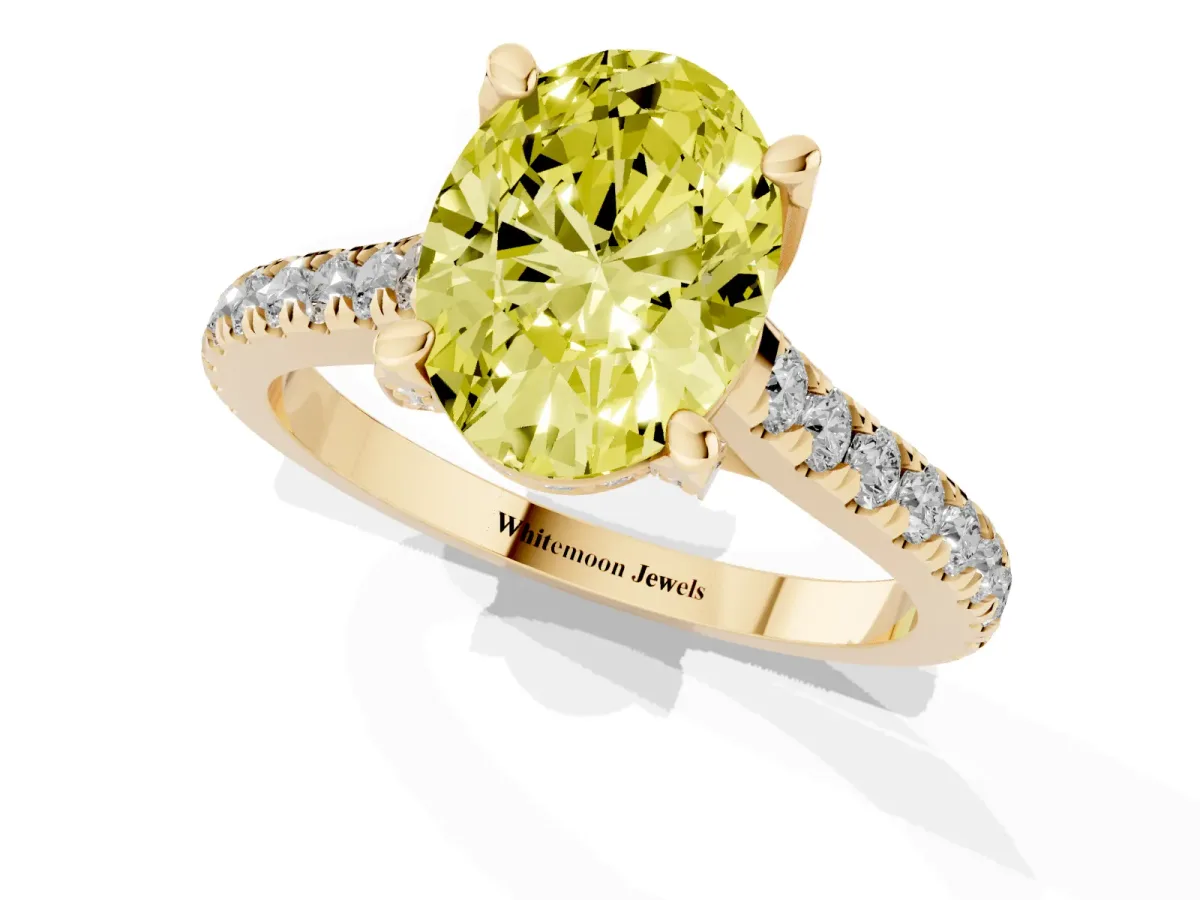 Fancy Yellow Oval Cut Brilliant Diamond Solitaire with Pavé Band and Four-Prong Setting Yellow gold