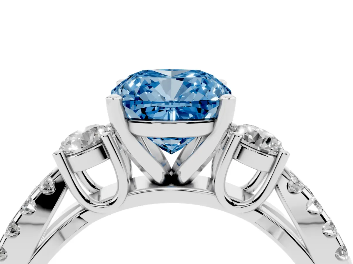 Fancy Blue Cushion Cut Diamond Three-Stone Ring with Pavé Split Shank and Four-Prong Setting Silver