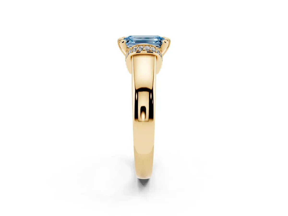 Fancy Blue Emerald Cut Solitaire Diamond Ring with Pave Band and Six-Prong Setting Yellow gold
