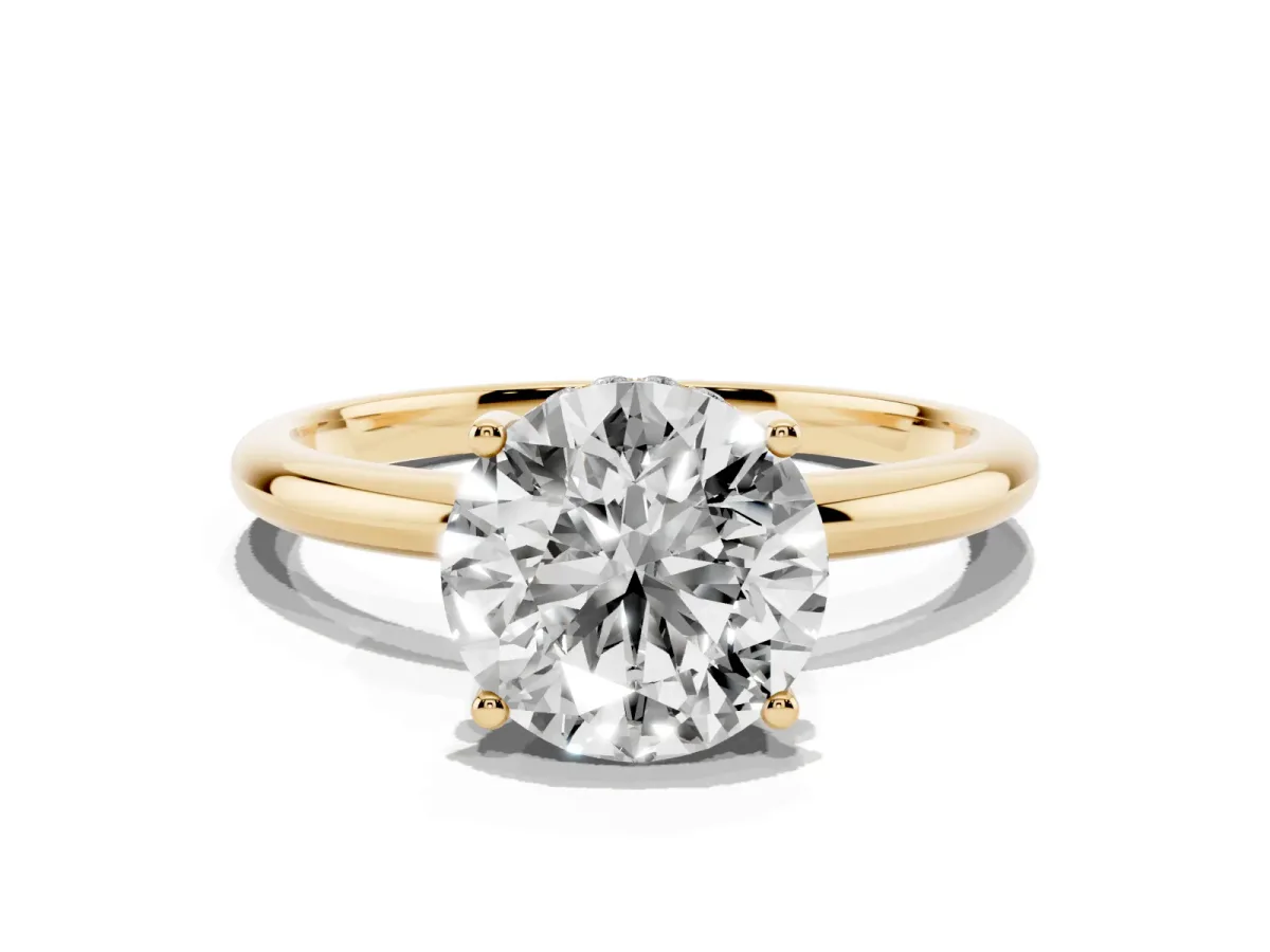 Round Cut Cut Solitaire Engagement Ring with Four-Prong Setting and Classic Band Yellow gold
