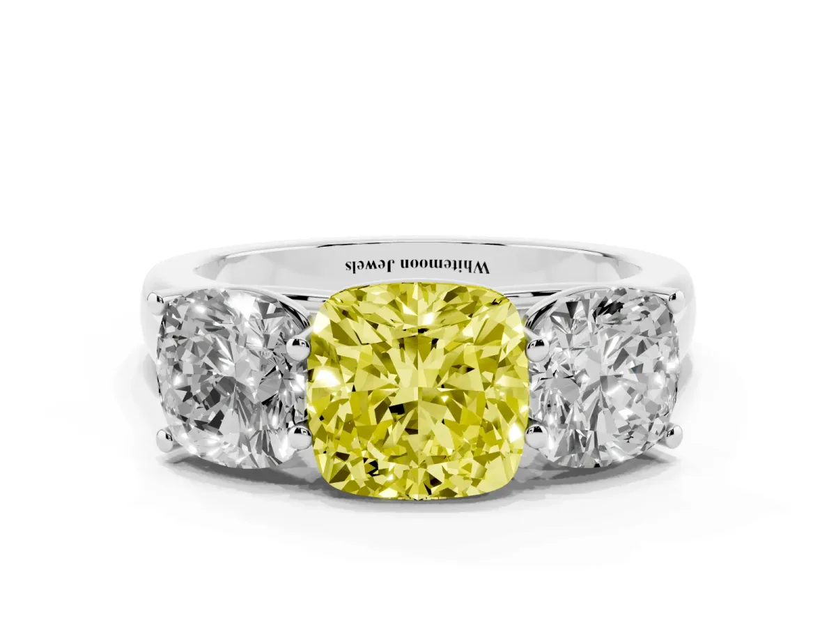 Fancy Yellow Cushion Cut Three-Stone Diamond Ring with Prong Setting on a Classic Band Platinum
