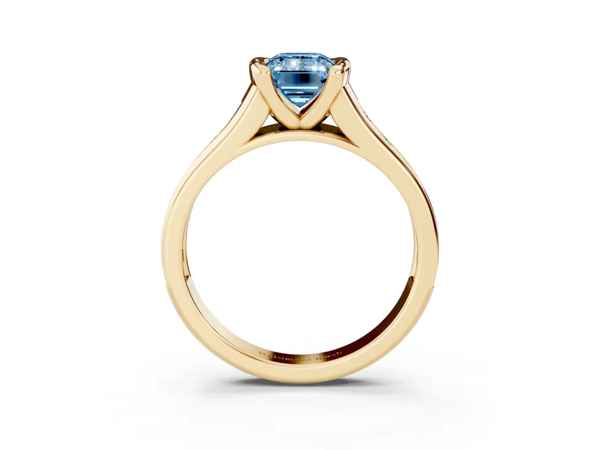 Fancy Blue Emerald Cut Solitaire Bezel-Set Diamond Ring with Channel-Set Band Yellow gold