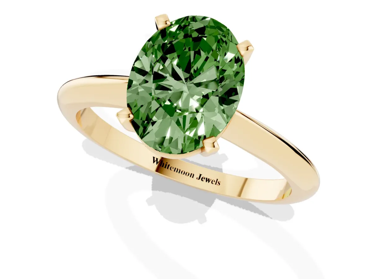Fancy Green Oval Cut Cut Solitaire Ring with Four-Prong Setting on a Classic Band Yellow gold