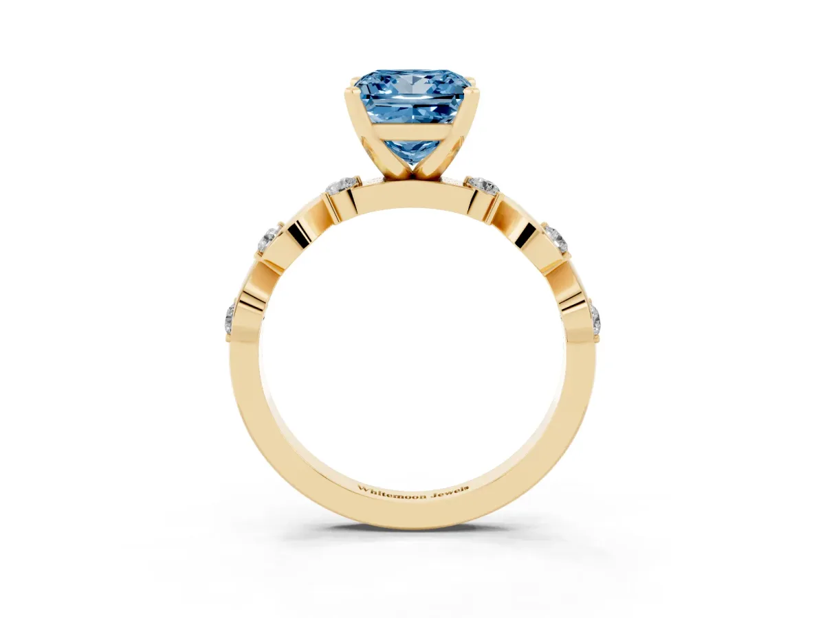 Fancy Blue Princess Cut Diamond Solitaire Twisted Band with Round Accents and Prong Setting Yellow gold