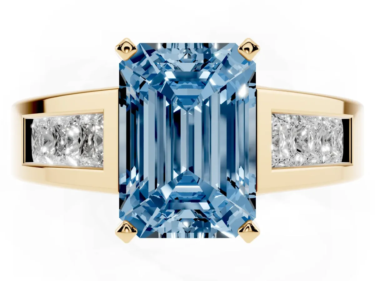 Fancy Blue Emerald Cut Cut Channel Set Solitaire Ring with Four-Prong Setting Yellow gold