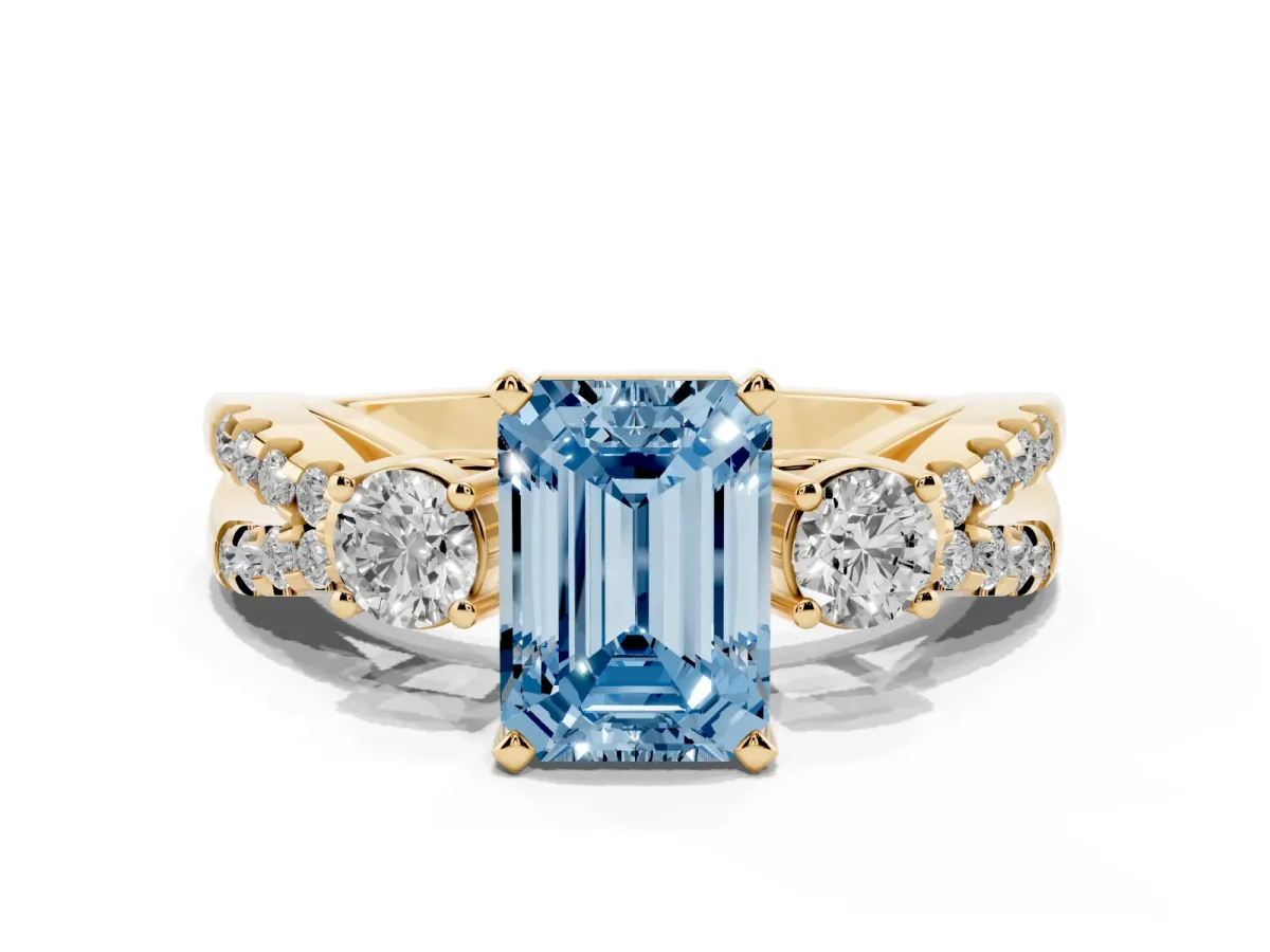 Fancy Blue Emerald Cut Diamond Three-Stone Ring with Pavé Split Shank and Four-Prong Setting Yellow gold