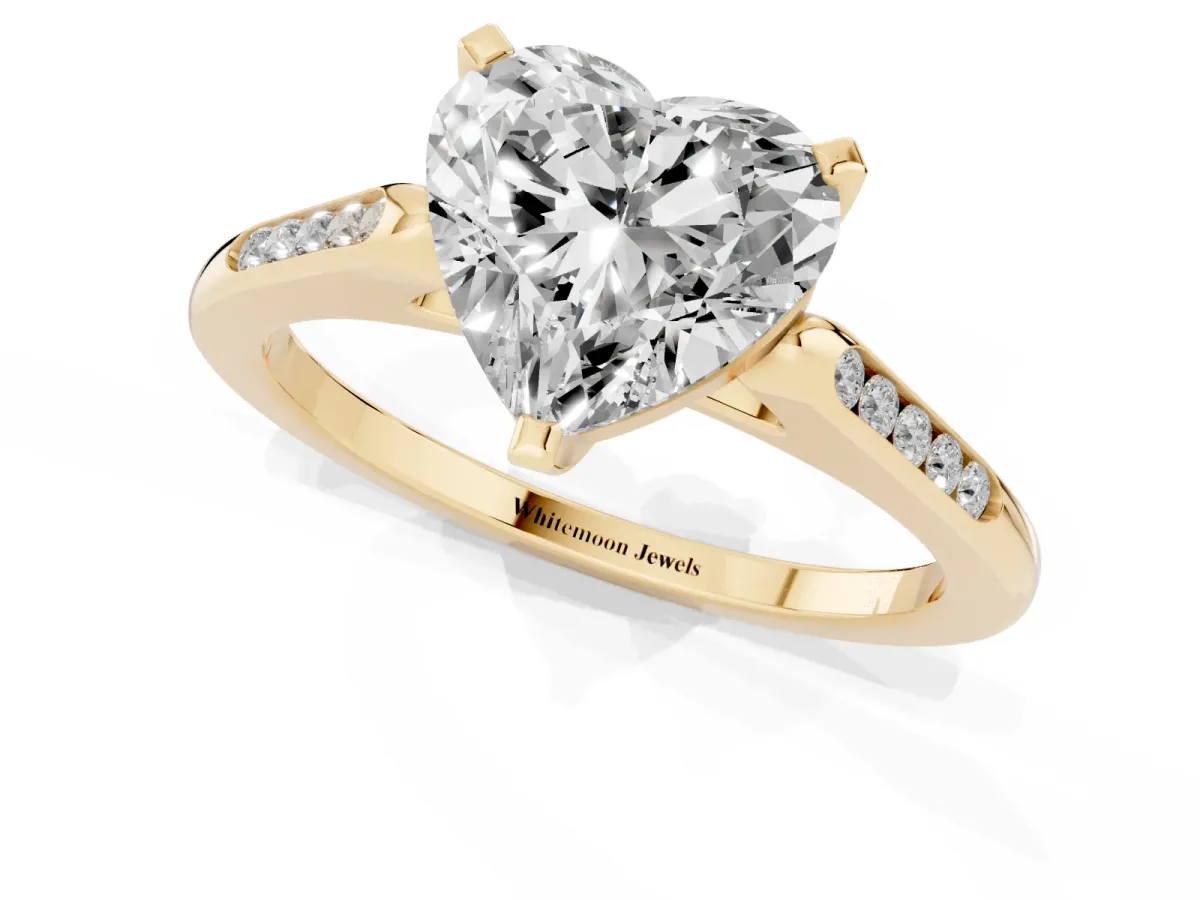 Heart Cut Diamond Solitaire Ring with Channel Set Round Band and Prong Setting Yellow gold