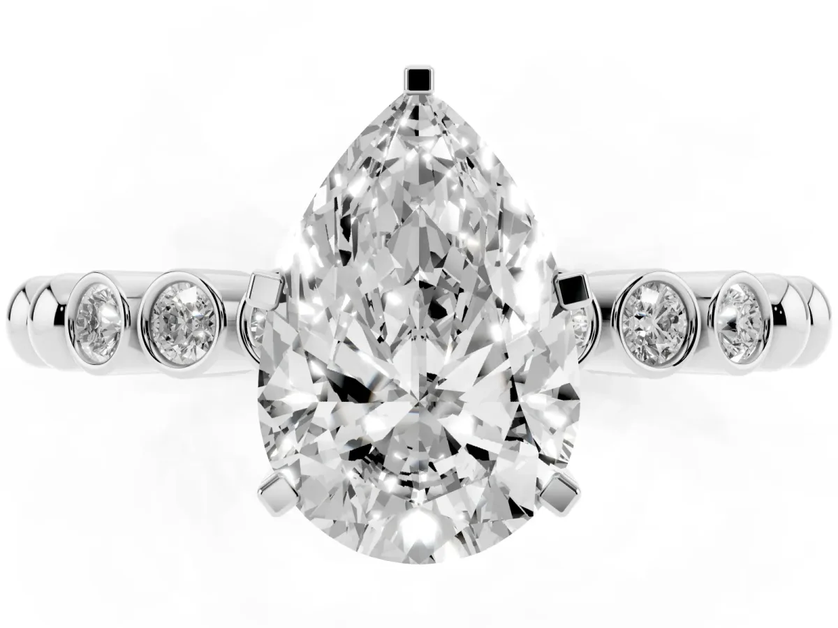 Pear Cut Solitaire Bezel Accent Diamond Engagement Ring with Beaded Band and Four-Prong Setting Platinum