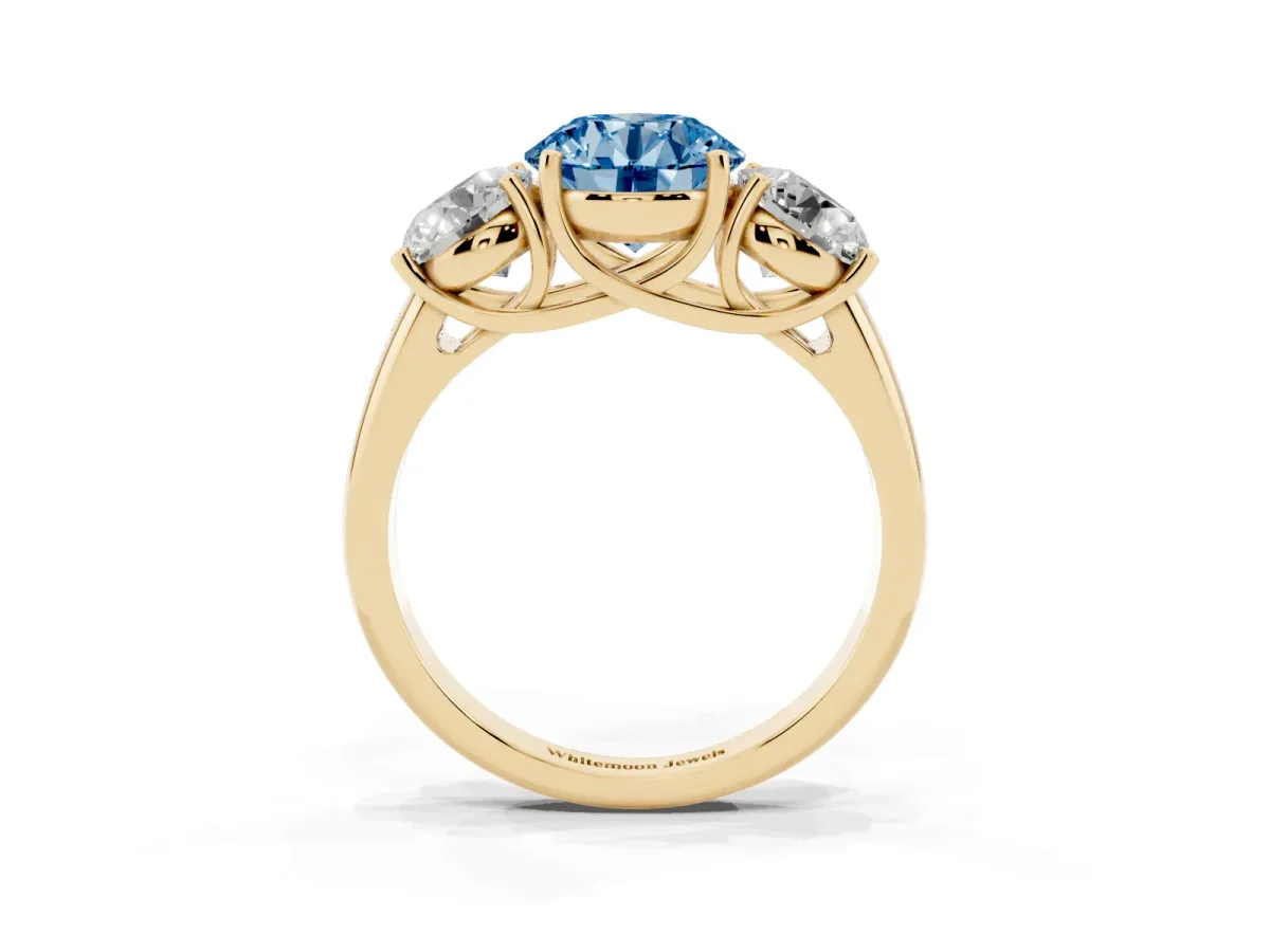 Fancy Blue Three-Stone Round Cut Diamond Engagement Ring with Prong Setting Yellow gold