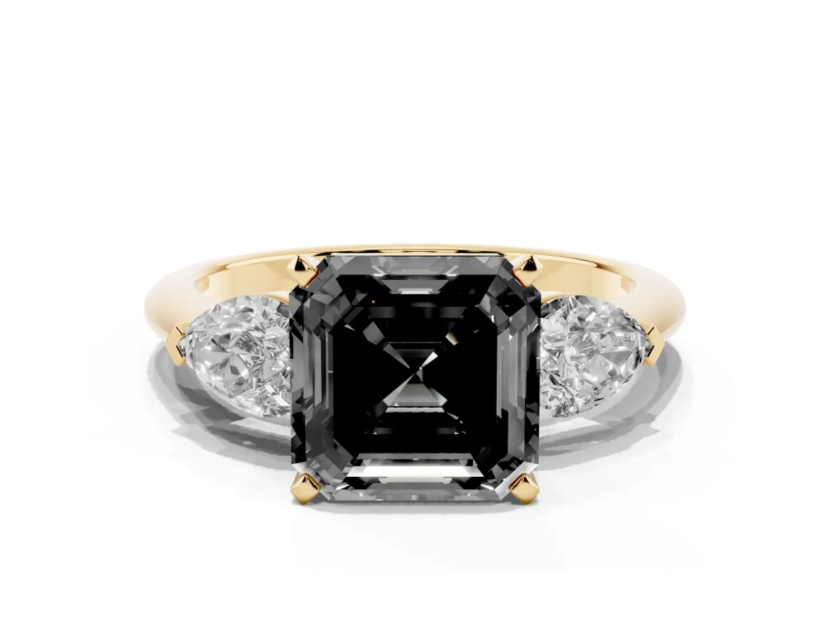 Fancy Black Three-Stone Asscher Cut Diamond Ring with Pear Side Stones and Four-Prong Setting Yellow gold