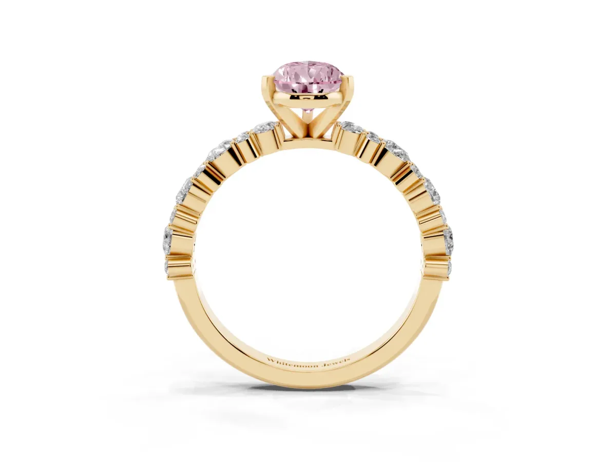 Fancy Pink Pear Cut Diamond Side Stone Solitaire Ring with Round and Four-Prong Setting Yellow gold