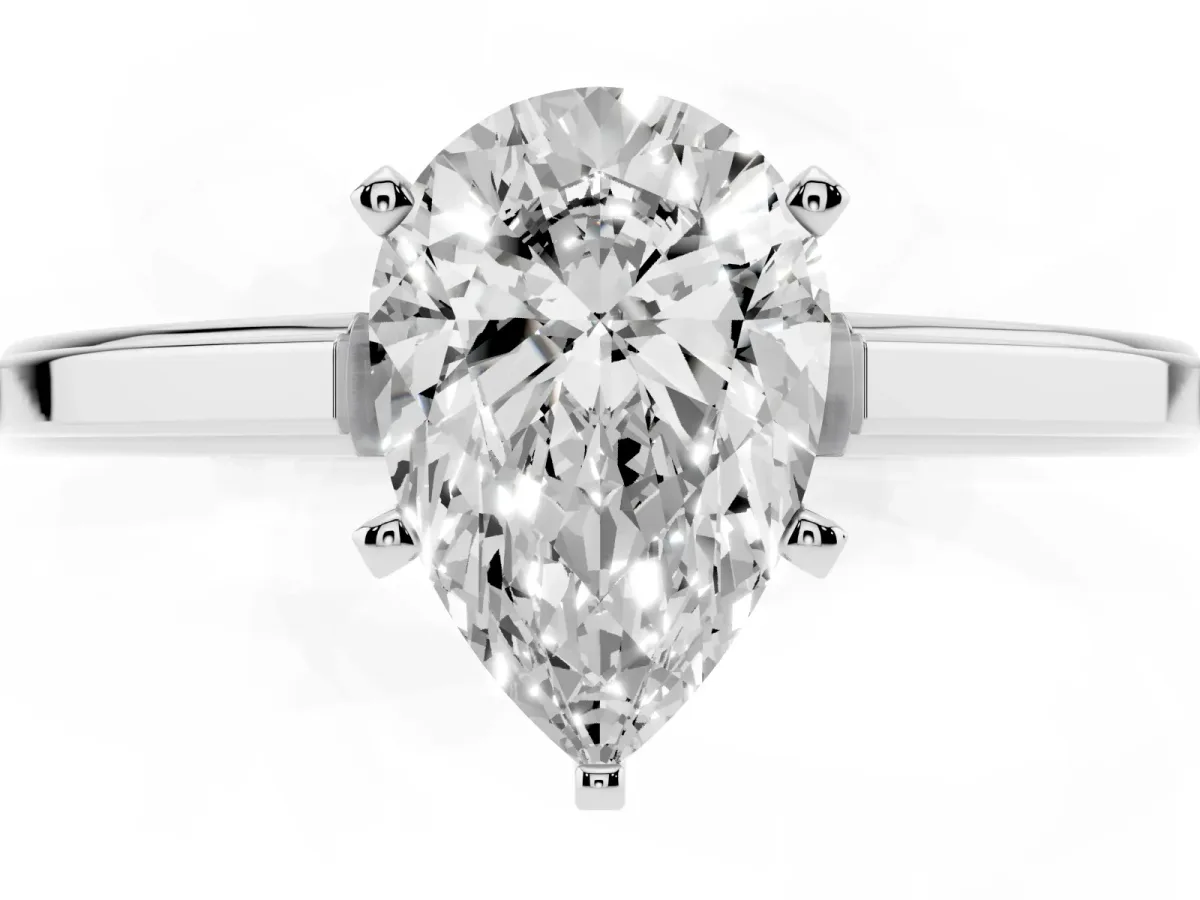 Pear Cut Solitaire Diamond Ring with Four-Prong Setting and Classic Band Platinum
