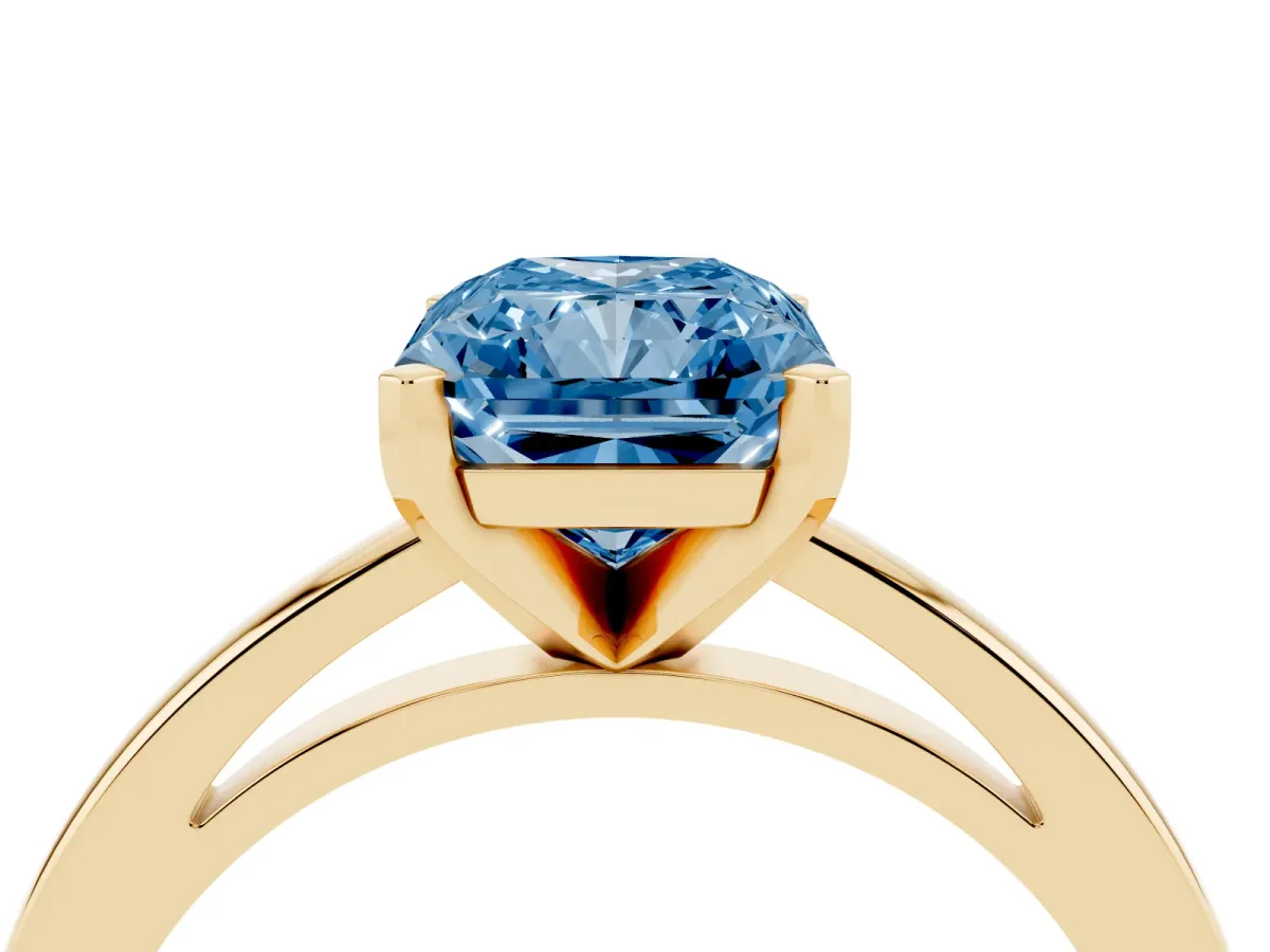 Fancy Blue Radiant Cut Solitaire Diamond Engagement Ring with Four-Prong Setting on a Classic Band Yellow gold