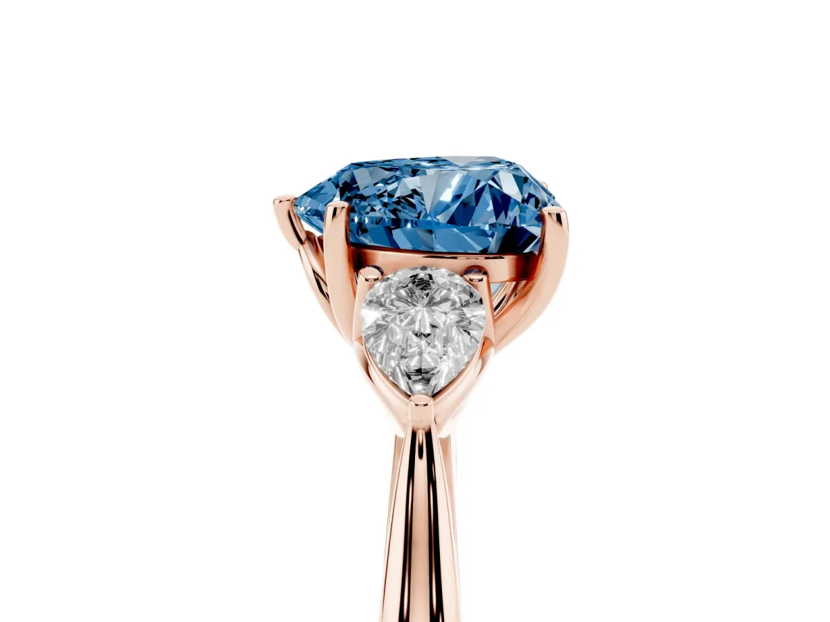 Fancy Blue Heart Cut Diamond Three-Stone Ring with Pear Side Stones and Prong Setting Rose gold
