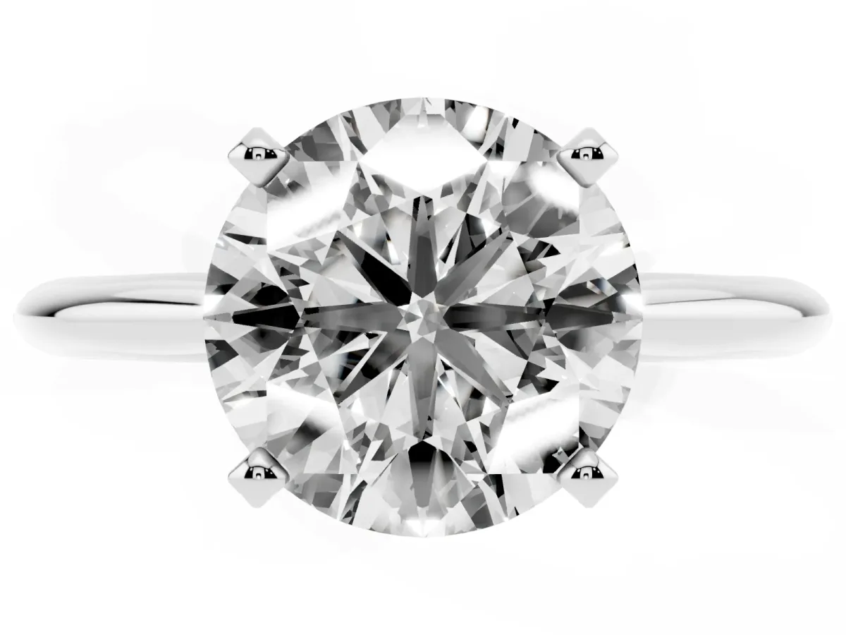 Round Cut Cut Solitaire Ring with Four-Prong Setting on a Classic Band Silver