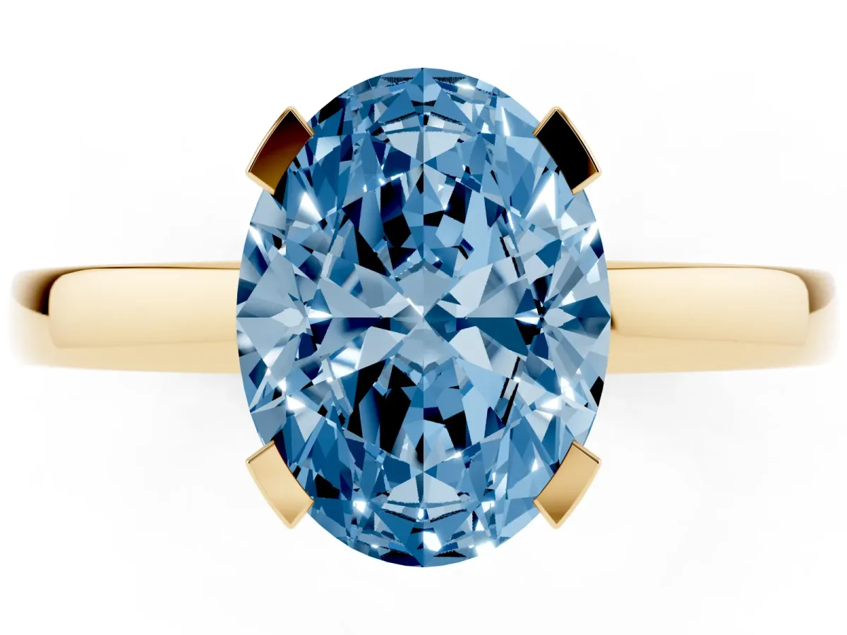 Fancy Blue Oval Cut Cut Solitaire Ring with Four-Prong Setting and Classic Band Yellow gold