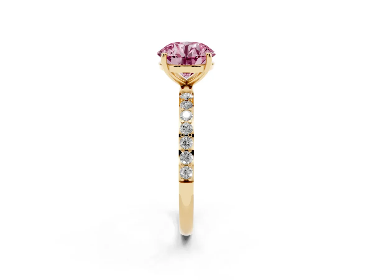 Fancy Pink Round Cut Diamond Solitaire Ring with Round Pavé Shoulders and Prong Setting Yellow gold
