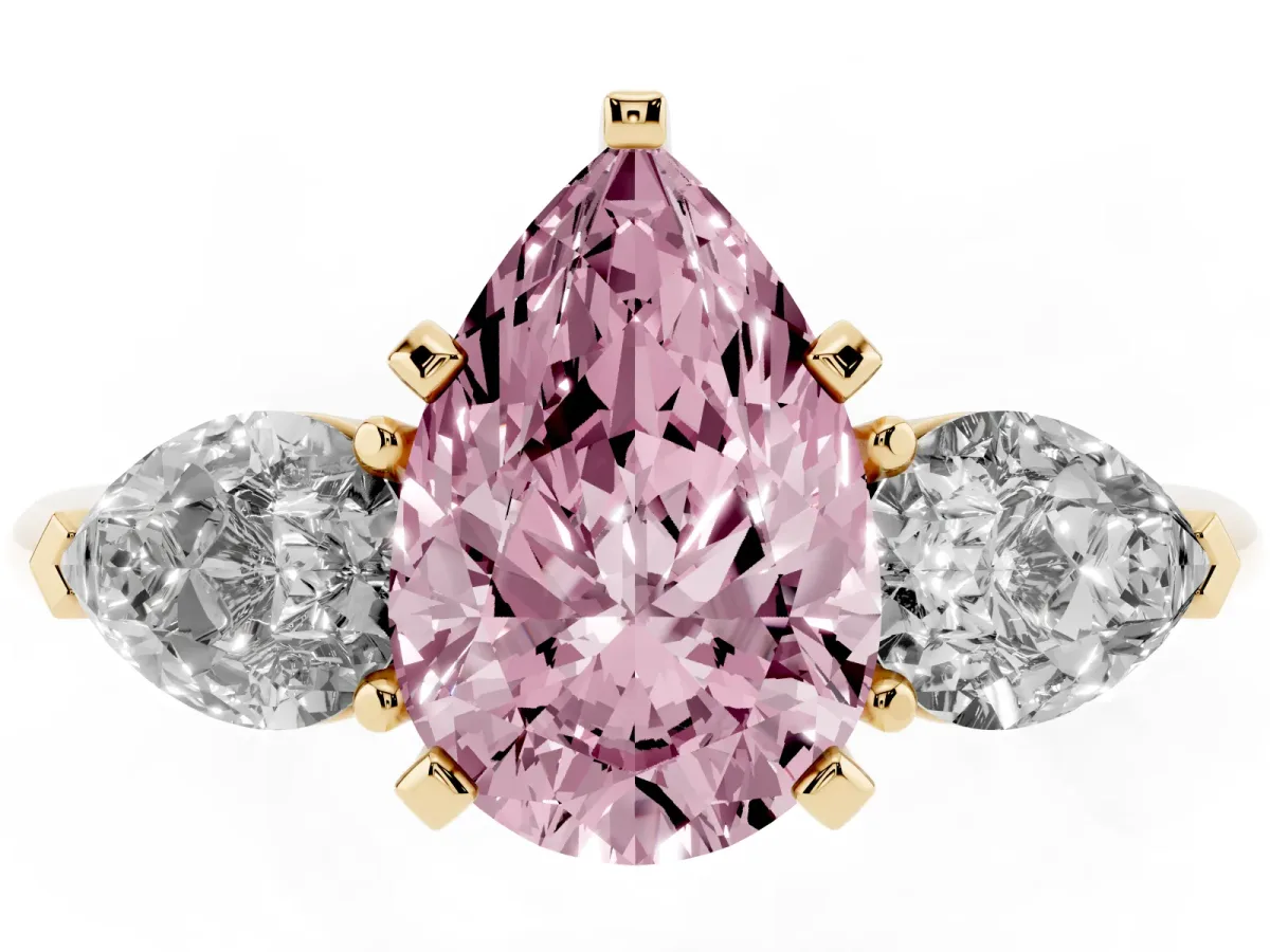 Fancy Pink Three-Stone Pear Cut Diamond Ring with Pear Side Stones and Four-Prong Setting Yellow gold