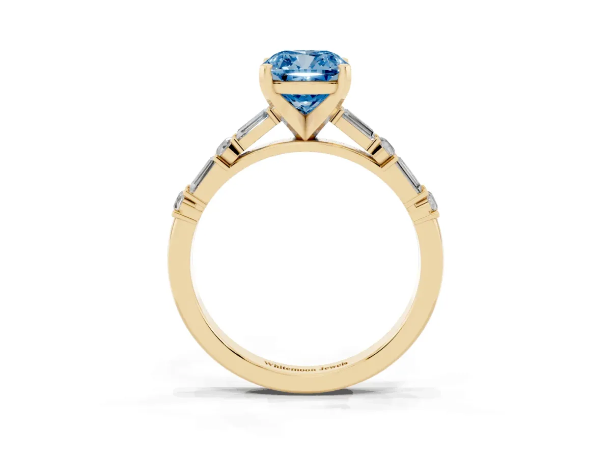 Fancy Blue Cushion Cut Diamond Solitaire with Side Baguettes and Channel Set Band Yellow gold