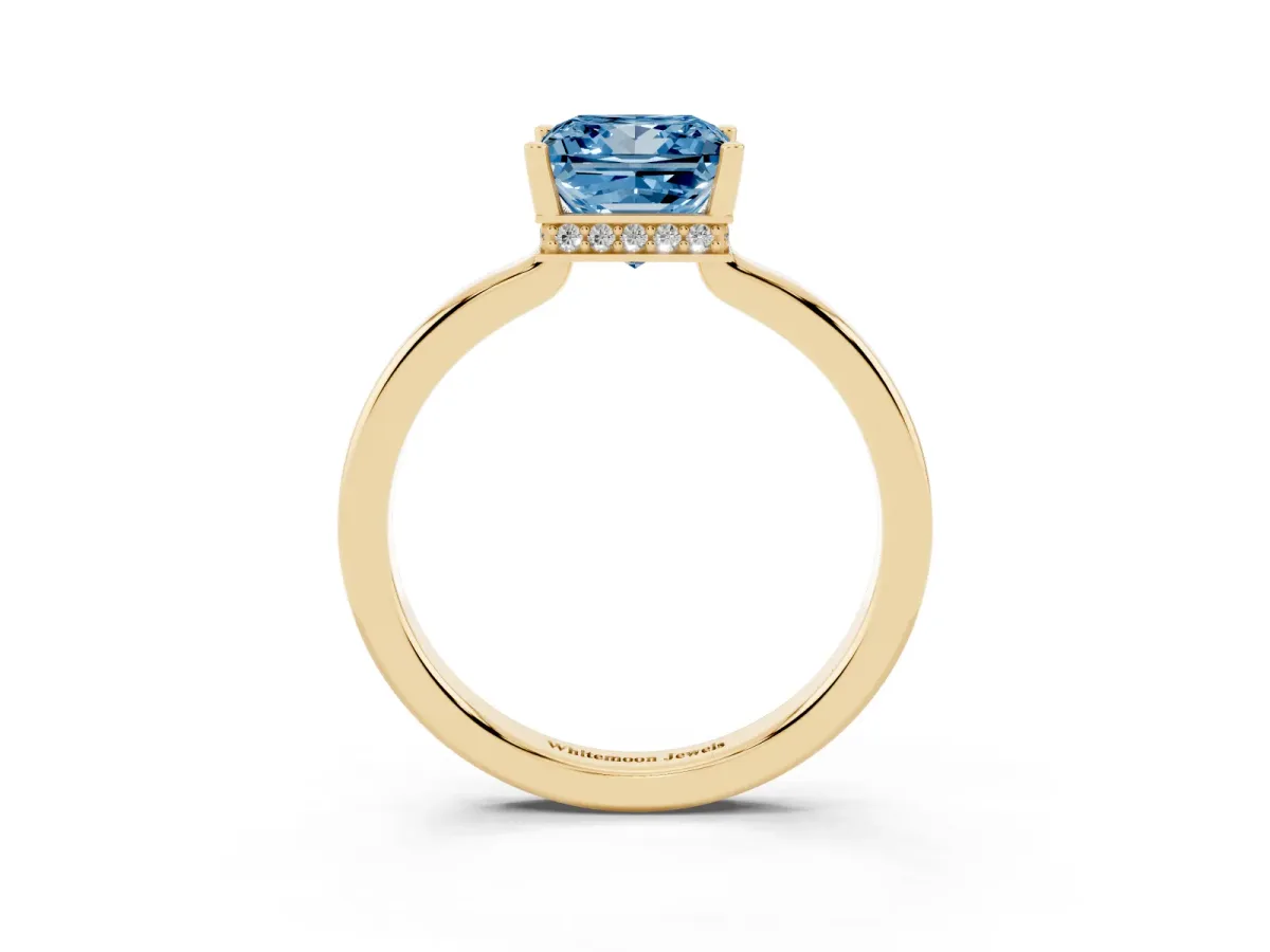 Fancy Blue Princess Cut Cut Solitaire Engagement Ring with Four-Prong Setting on a Classic Band Yellow gold