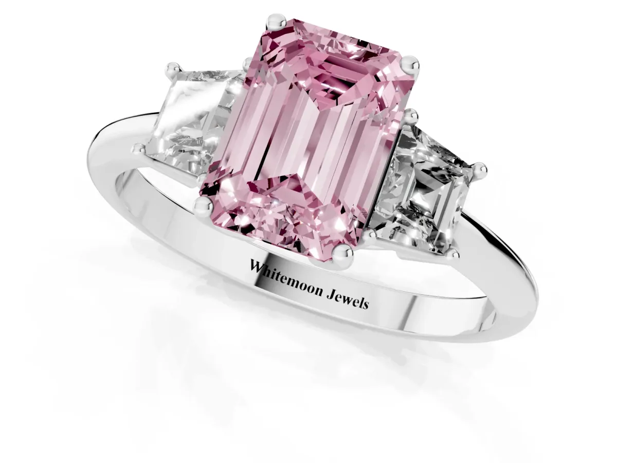 Fancy Pink Emerald Cut Diamond Three-Stone Ring with Trapezoid Side Stones and Prong Setting Platinum