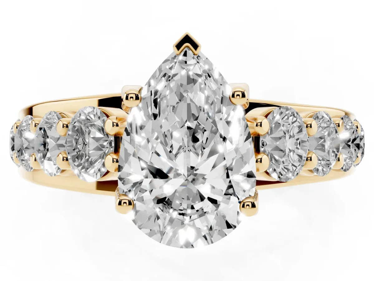 Pear Cut Diamond Engagement Ring with Pavé Band and Four-Prong Setting Yellow gold
