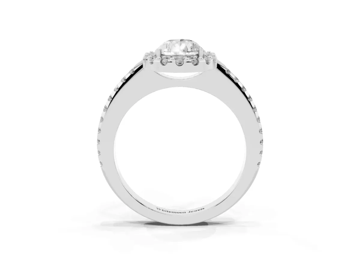 Pear Cut Diamond Pavé Halo Ring with Four-Prong Setting Platinum